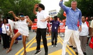 Mayor Warren Wilhelm Jr., (right) engages in a dignified celebration of not having his head up his ass.