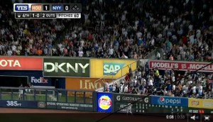 The blogger known as Manhattan Infidel watches Stephen Drew hit a home run into the bullpen.  I am in the blue shirt right above the "M" in the Modells sign.